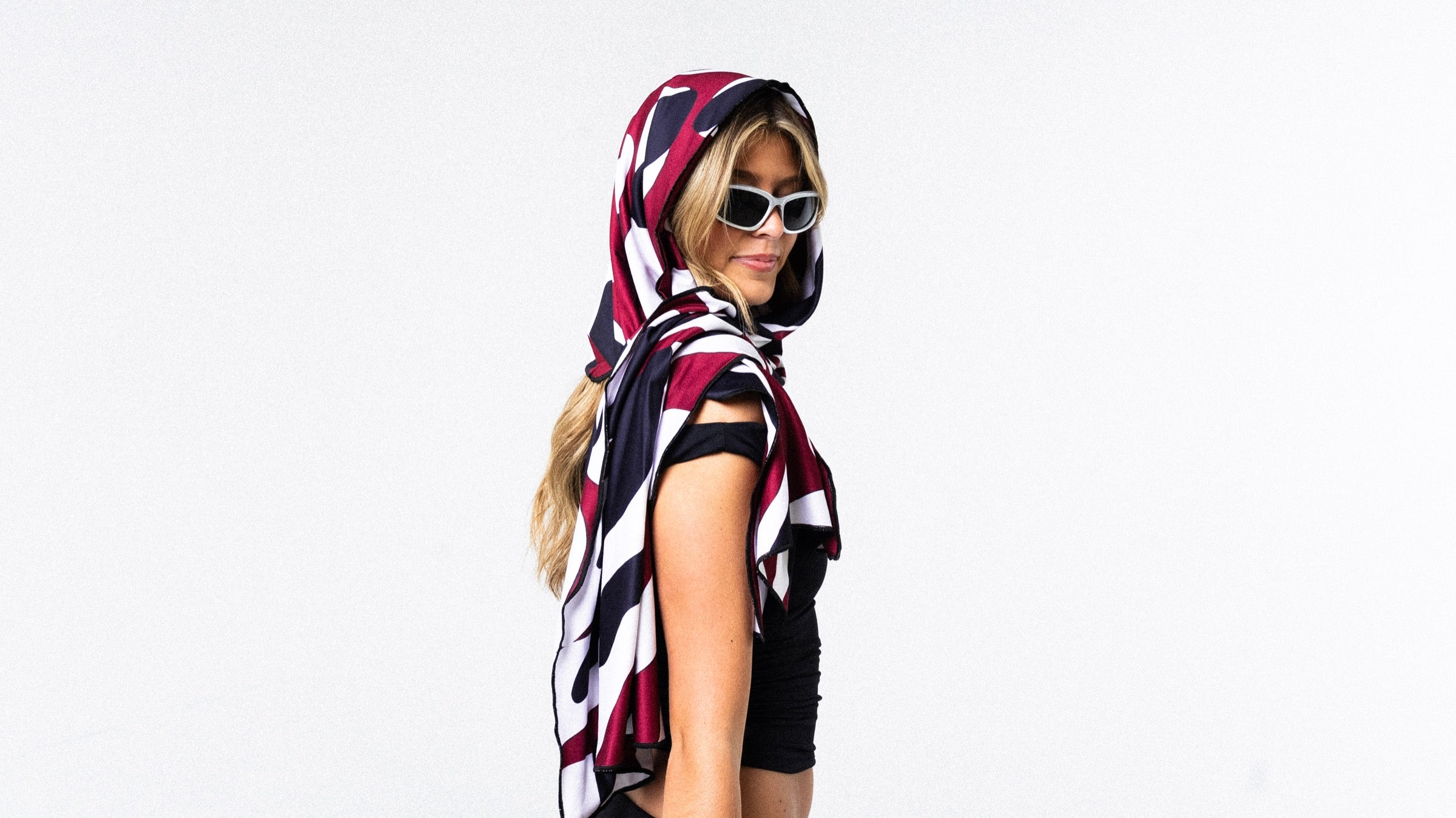 Model wearing a Tech Towel as a hooded festival layer