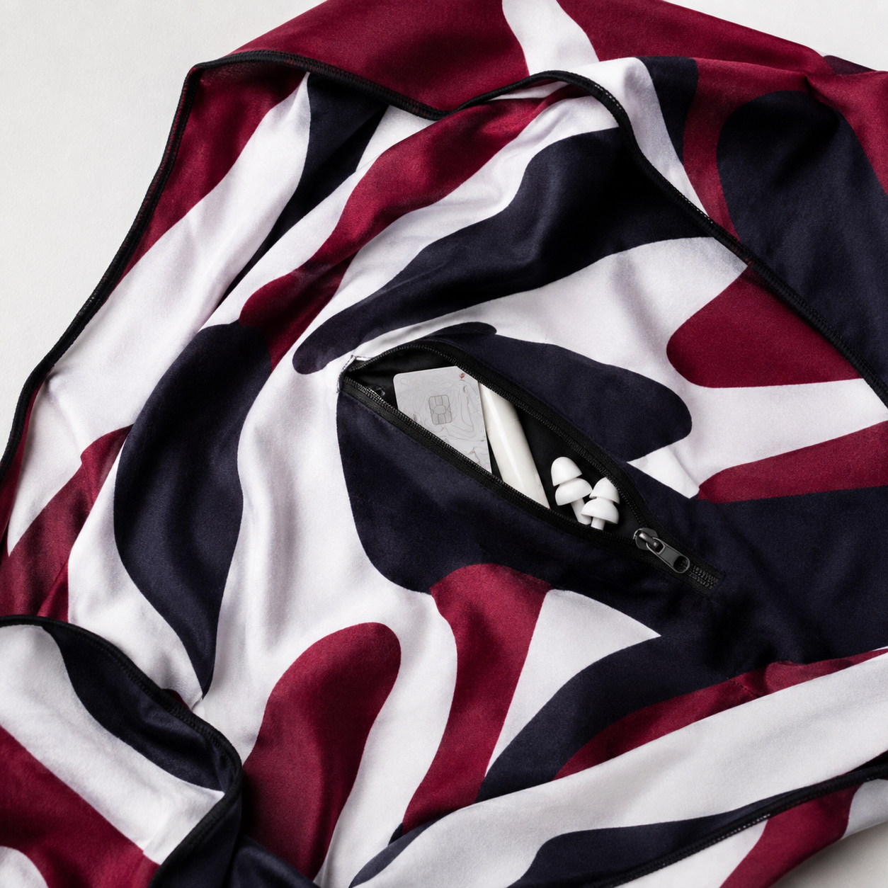 Hidden zipper pocket holding small festival essentials